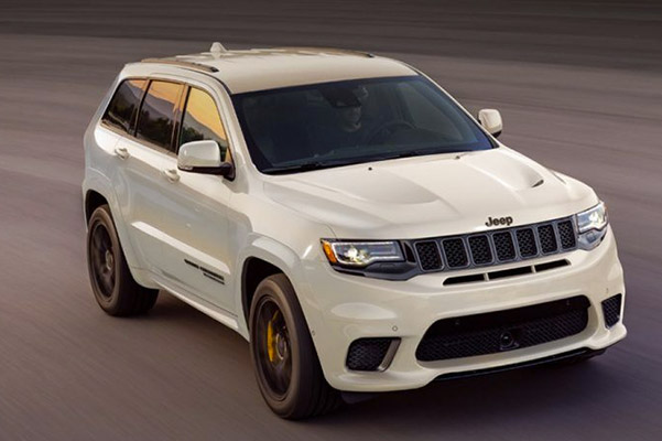 2020 Jeep Grand Cherokee driving down highway