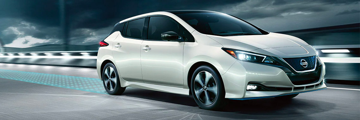 2020 NISSAN LEAF® driving down road