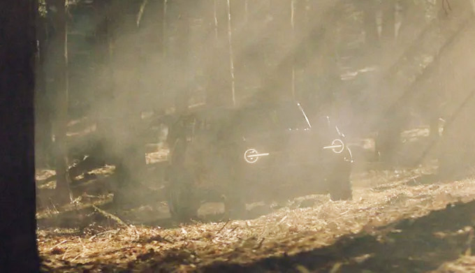 Ford Bronco driving through muddy water on its way to its destination in the wild