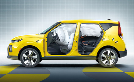 Safety airbags shown inside yellow Kia Soul