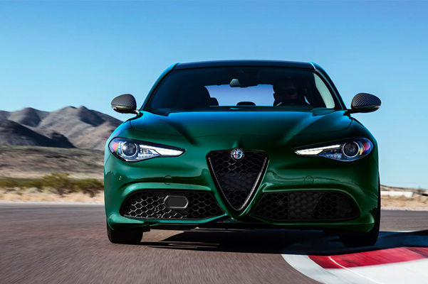 Front view of a 2021 Alfa Romeo Giulia driving on a track