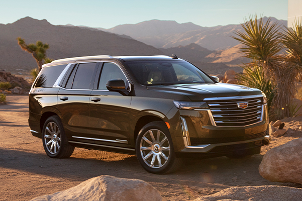 2021 Cadillac Escalade parked on sand in sun