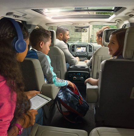 Interior shot of the 2021 Ford Expedition with a family of five enjoying the space and comfort
