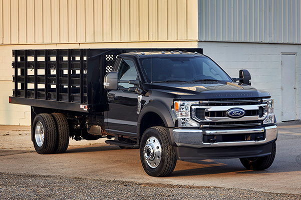 2021 Ford Super Duty® F-600 parked in front of a basic building