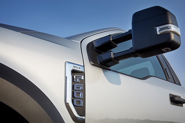 Close up shot of a 2021 Ford Super Duty® F-600 door, window and F-600 emblem