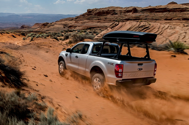 Ranger driving along a desert 