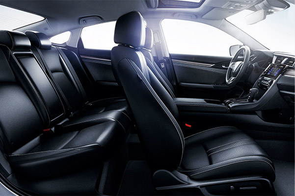 Passenger-side interior view of the 2021 Honda Civic Touring Sedan with Black Leather.
