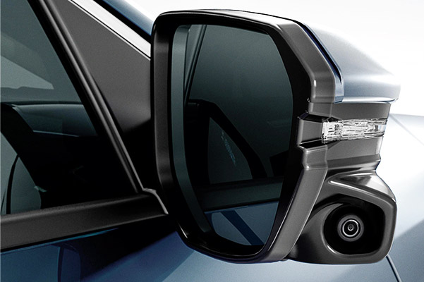 Honda LaneWatch<sup>™</sup> camera detail on passenger-side mirror on the 2021 Honda Civic Touring Sedan in Cosmic Blue Metallic.