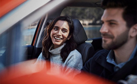 Happy couple enjoying a safe car ride in their new 2021 Hyundai Sonata