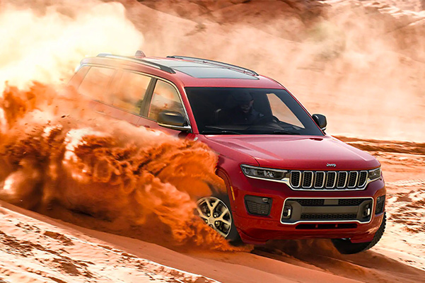 2021 Jeep Grand Cherokee L driving on sand