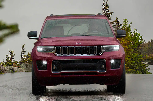 2021 Jeep Grand Cherokee L driving on rainy road