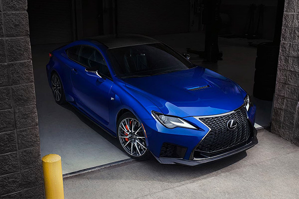 2021 Lexus RC F shown in Ultrasonic Blue Mica 2.0 exiting a parking garage