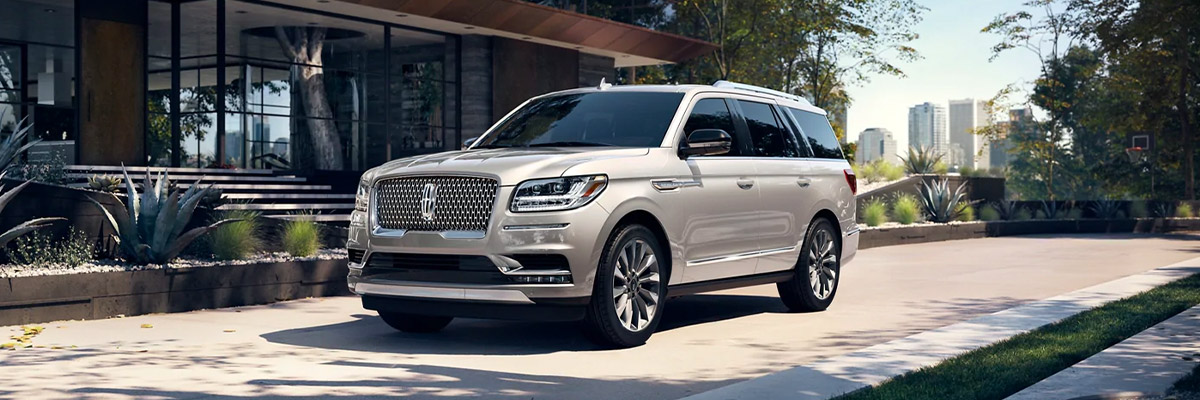 2021 Lincoln Navigator parked outside a modern home right outside the city