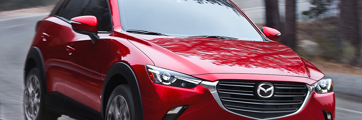 Close up shot of the 2021 Mazda CX-3 in action down a highway