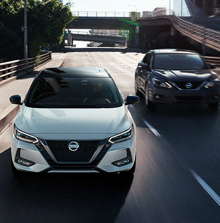 Front view of 2021 Nissan Sentras driving side by side