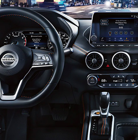 Interior shot of the 2021 Nissan Sentra to include the steering wheel and touch screen nav
