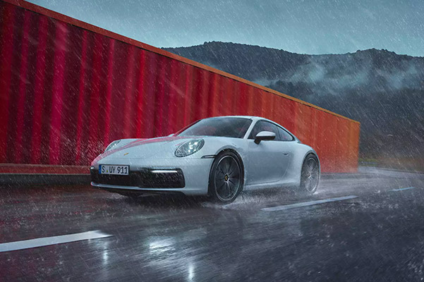 2021 Porsche 911 driving through a rain storm