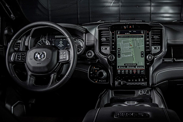 Display The steering wheel, instrument panel, touchscreen and glovebox in the 2021 Ram 2500 Power Wagon 75th Anniversary Edition.