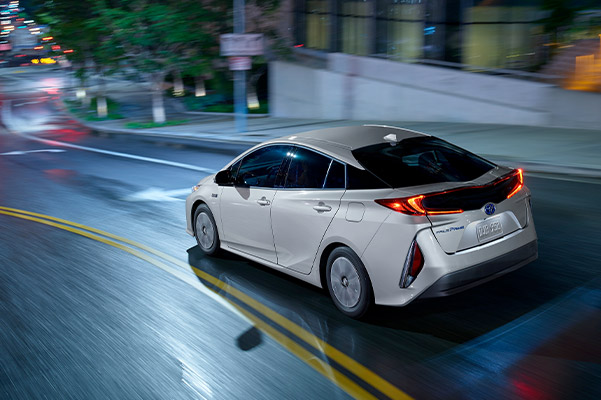 2021 Toyota Prius Prime driving at night on road