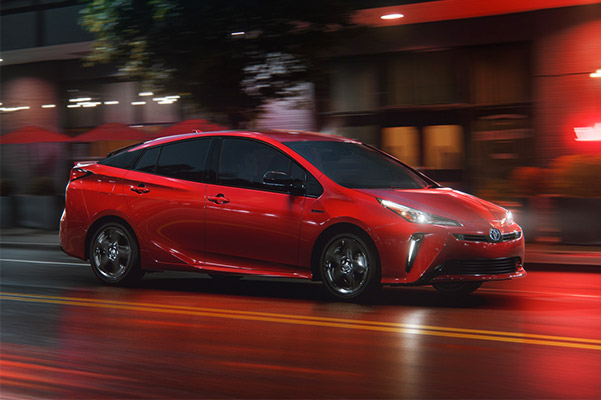 2021 Toyota Prius Prime on wet road at nighttime