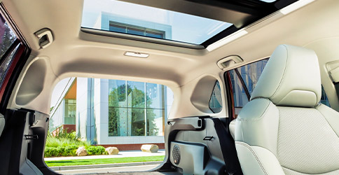 Privacy glass in rear as well as moon roof and spacious hatch shown in a 2021 Toyota RAV4