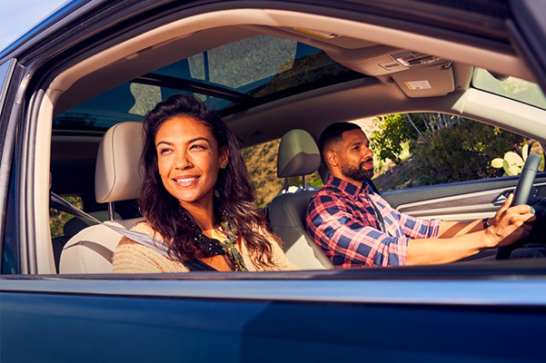 Couple driving in a 2021 Volkswagen Atlas