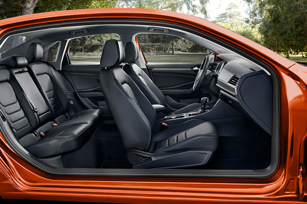A side profile of a Jetta showcasing its interior in available Titan Black leather.