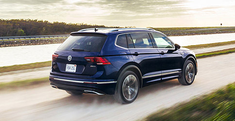 2021 Volkswagen Tiguan rear driving on road