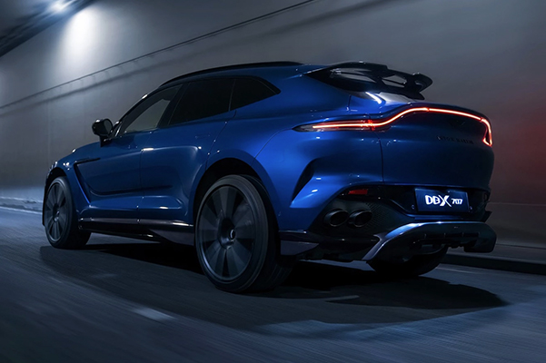 Aston Martin DBX exterior rear driver side view in motion