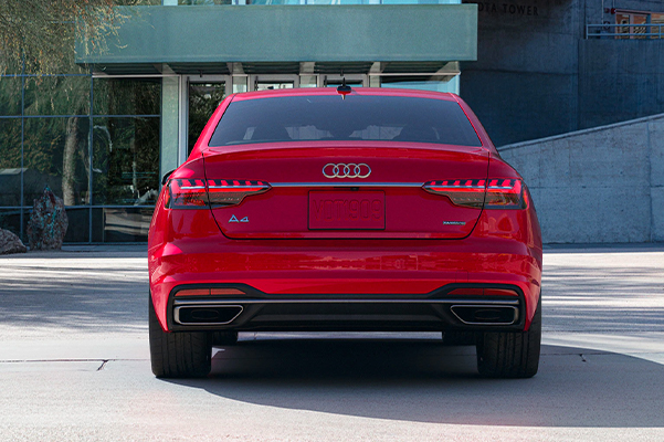 Rear exterior shot of a 2022 Audi A4 while backing up.