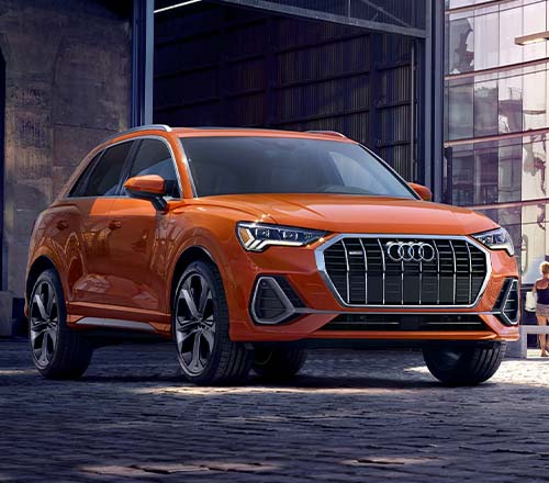 Orange 2022 Audi Q3 parked in the shade