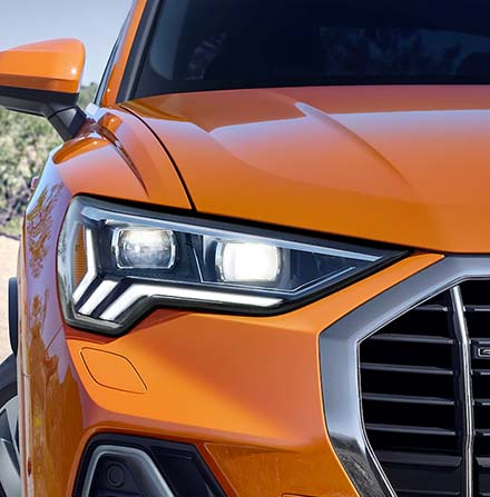 close up headlight view of the 2022 Audi Q3