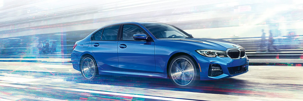 The 2022 BMW 3 Series Sedan accelerates through a glitchy landscape