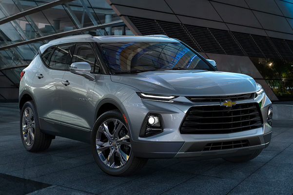 2022 Chevrolet Blazer parked in front of modern looking glass building