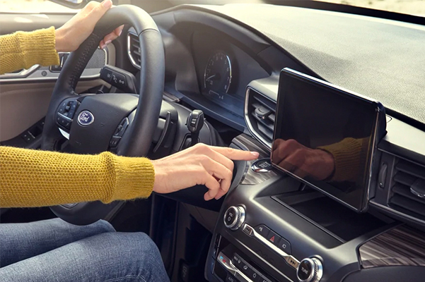 Person in a Ford vehicle using the radio