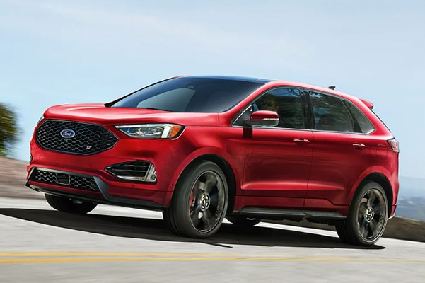 2022 Ford Edge in Rapid Red being driven up a mountain road