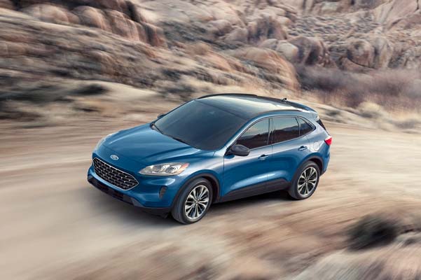 2022 Ford Escape driving on a dirt path in the mountains