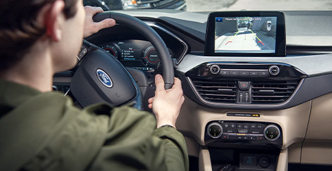 The 2022 Ford Escape eight-inch touchscreen showing an image of what is behind the vehicle while in reverse