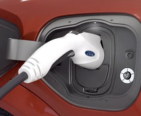 A close up of the Ford Mobile charger plugged into a 2021 Ford Mustang Mach E