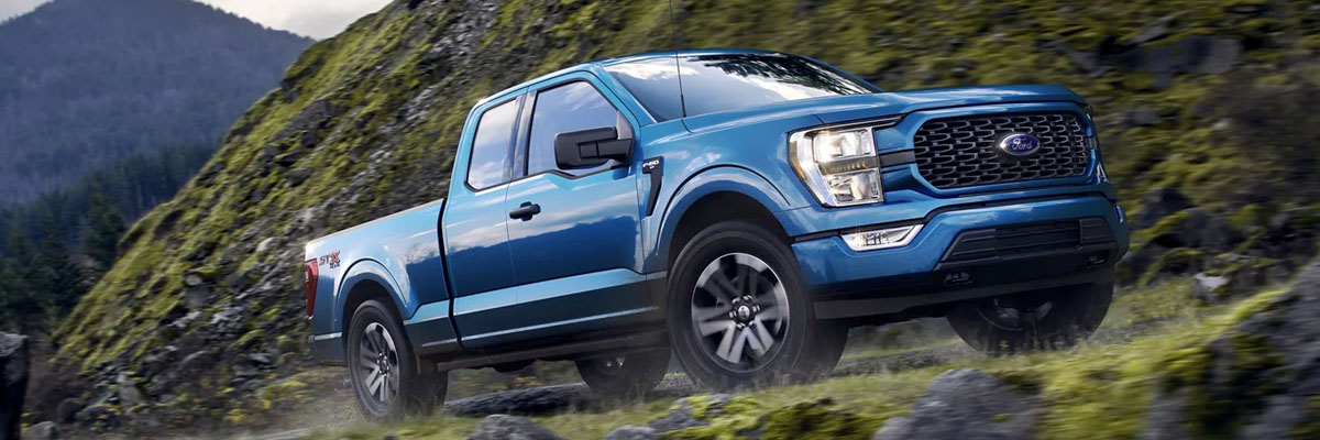 A 2023 Ford F-150 being driven up the side of a mountain