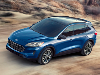 2022 Ford Escape SE with the available Sport Appearance Package in Atlas Blue Metallic being driven on a mountain road