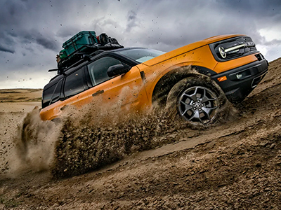 The 2022 Ford Bronco™ Sport shown driving up a dirt hill