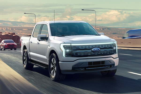 2022 Ford F-150 Lightning Driving Down The Road