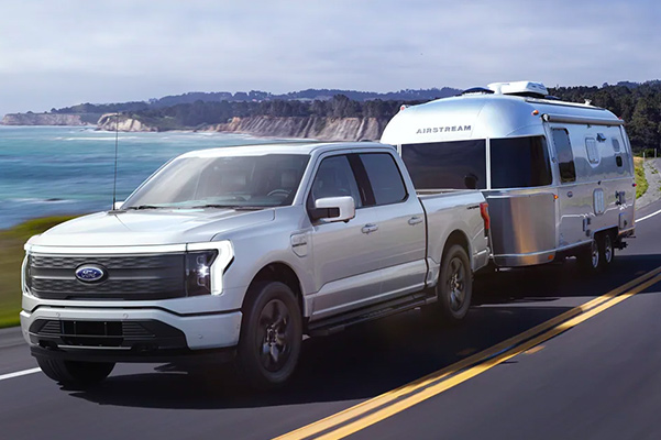 2022 FORD F-150 LIGHTNING towing a camper