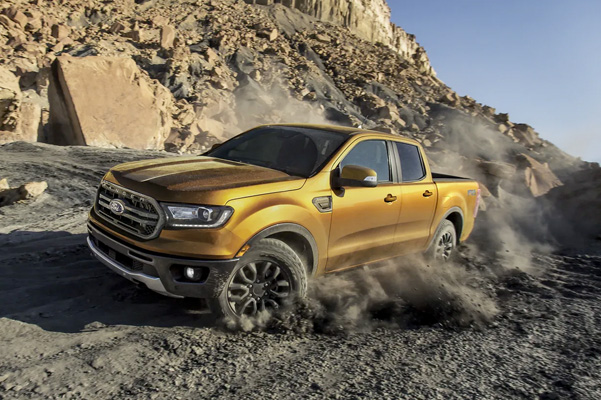2022 Ford Ranger FX4 being driven up a gravel hill.