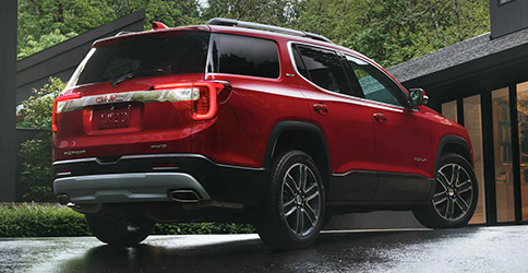Rear view of red 2022 GMC Acadia