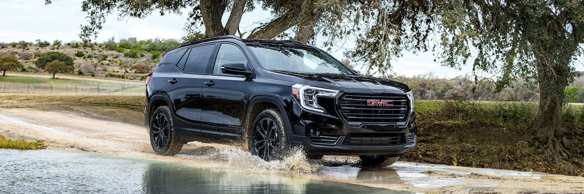 2022 GMC Terrain SLE/SLT Small SUV Driving on Dirt Road - Side View