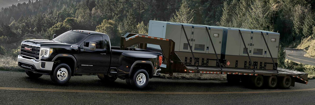 2022 GMC Sierra HD Heavy Duty Truck towing trailer up hill