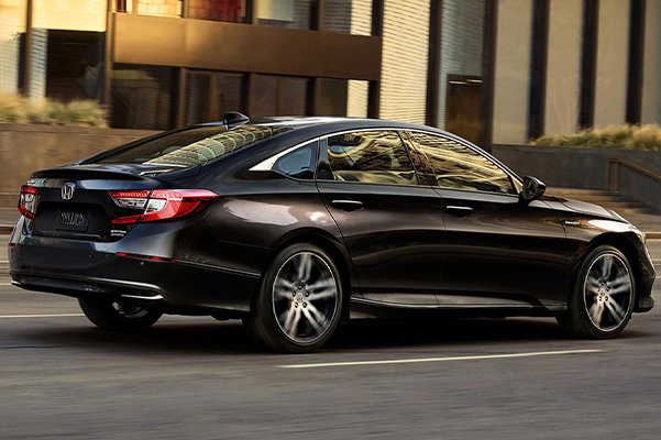Side view of the 2022 Honda Accord Hybrid driving down the street