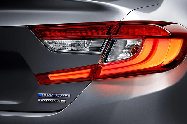 Back headlights of the 2022 Honda Accord Hybrid showing the hybrid badge
